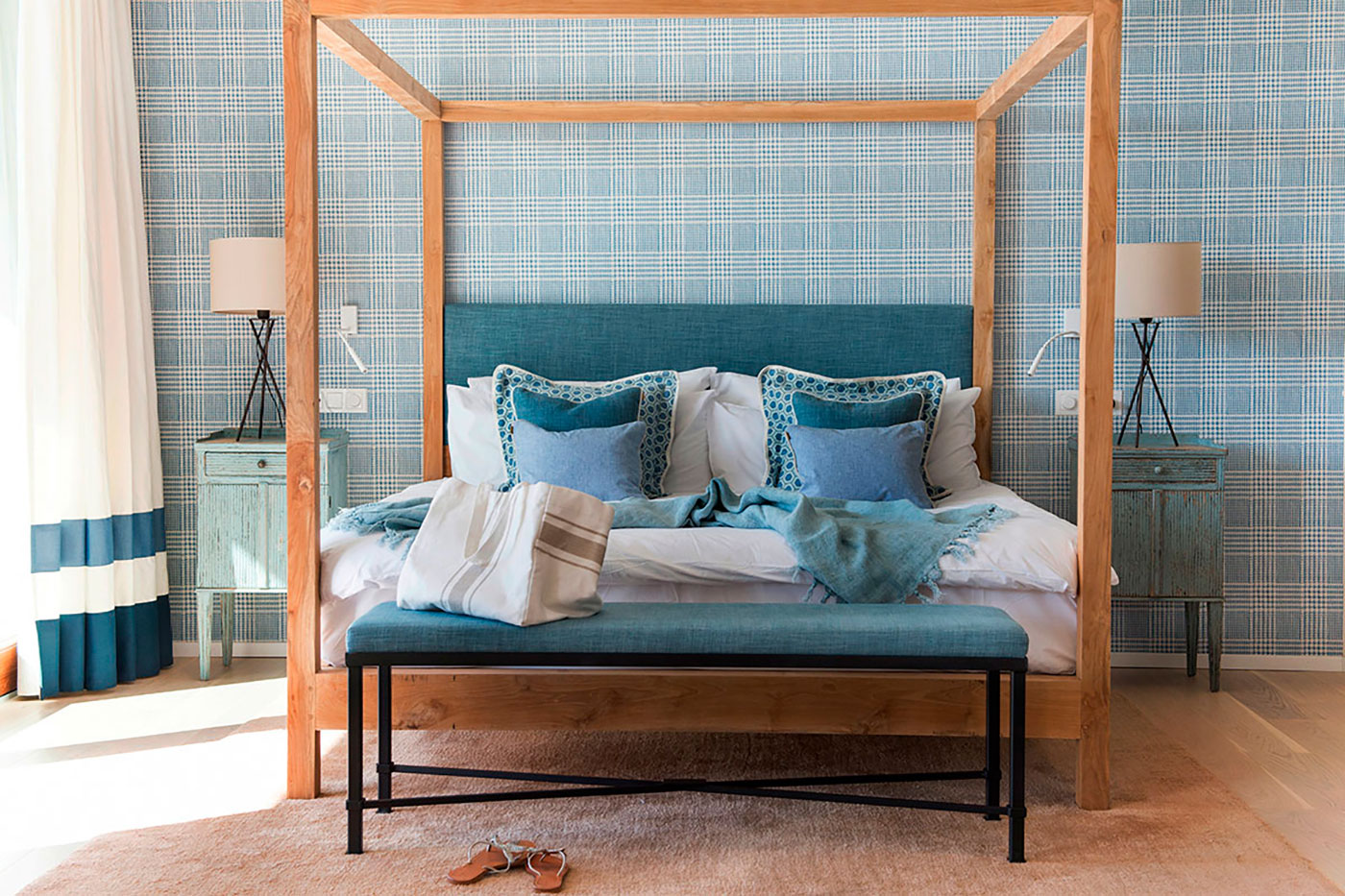 Elegant bedroom furniture and cozy bedding.