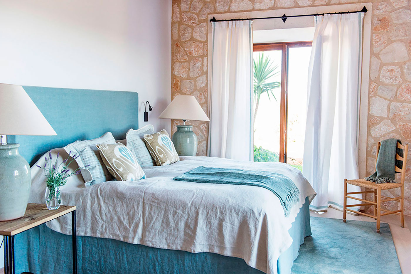 Elegant bedroom furniture and cozy bedding.